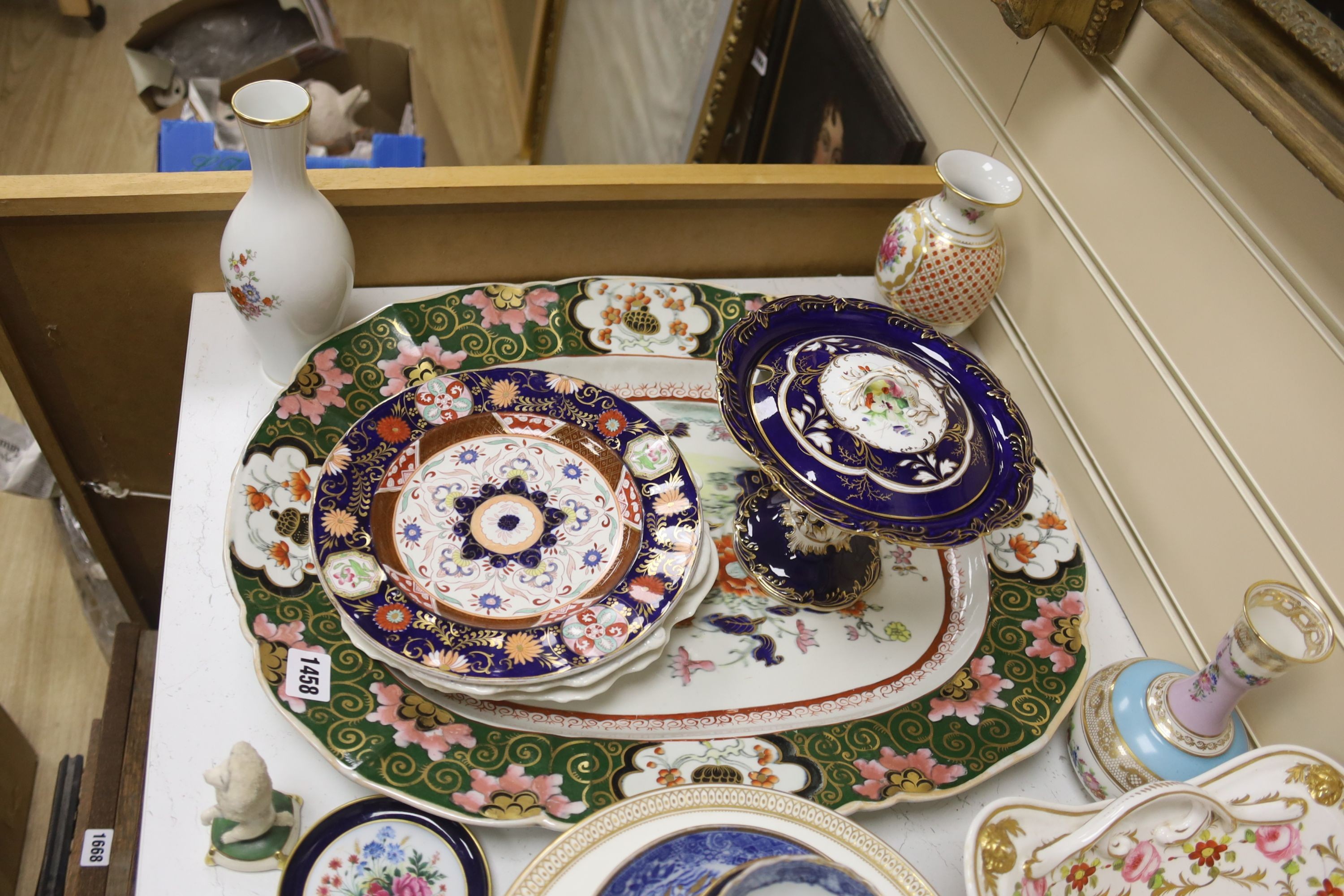 A collection of decorative ceramics to include cabinet cups and saucers, a delft casket, vases, etc.